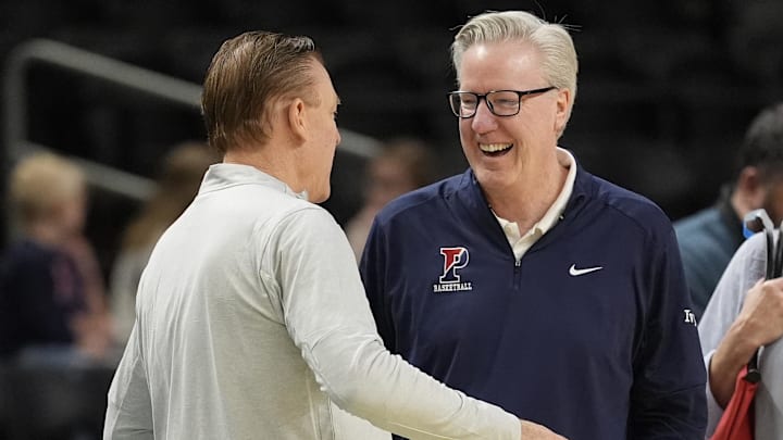 Mar 18, 2026; Greenville, SC, USA; Illinois Fighting Illini head coach Brad Underwood chats with Penn Quakers head coach Fran McCaffery during a practice session ahead of the first round of the men's 2026 NCAA Tournament at Bon Secours Wellness Arena. Mandatory Credit: Jim Dedmon-Imagn Images