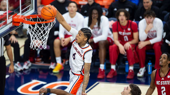Auburn Tigers guard Elyjah Freeman (6) dunks the ball as Auburn Tigers take on NC State Wolfpack at Neville Arena in Auburn, Ala. on Wednesday, Dec. 3, 2025. Auburn Tigers lead NC State Wolfpack 41-35 at halftime.