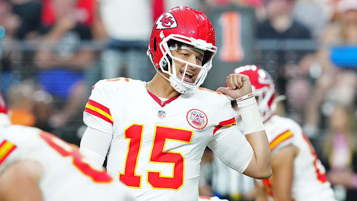 Oct 27, 2024; Paradise, Nevada, USA; Kansas City Chiefs quarterback Patrick Mahomes (15) talks to Kansas City Chiefs wide receiver Xavier Worthy (1) before snapping the ball against the Las Vegas Raiders during the third quarter at Allegiant Stadium. Mandatory Credit: Stephen R. Sylvanie-Imagn Images