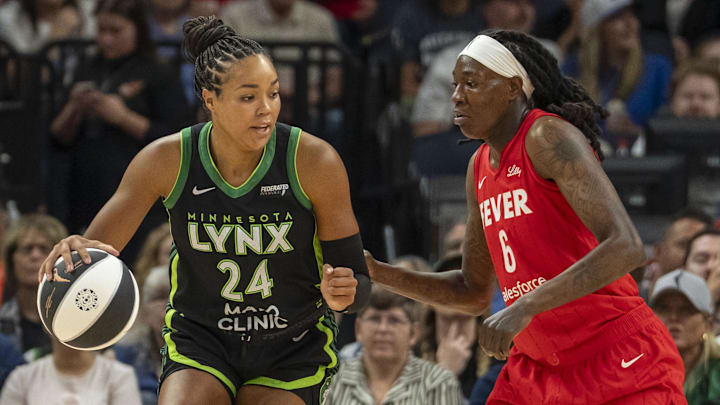 Jul 1, 2025; Minneapolis, Minnesota, USA; Minnesota Lynx forward Napheesa Collier (24) backs towards the basket against Indiana Fever forward Natasha Howard (6) in the first half during the Commissioner's Cup final at Target Center. Mandatory Credit: Jesse Johnson-Imagn Images