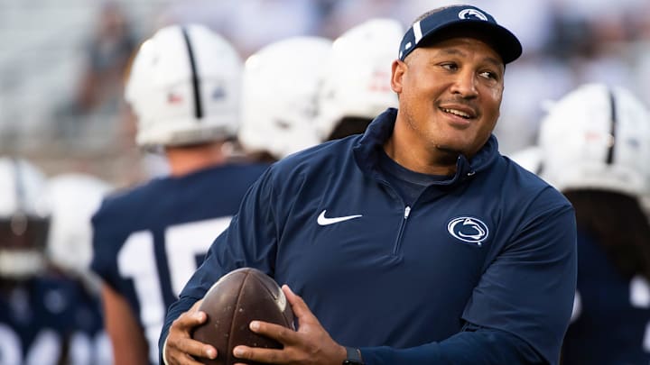 Penn State running backs coach Ja'Juan Seider catches a ball during warmups before facing West Virginia at Beaver Stadium in 2023.
