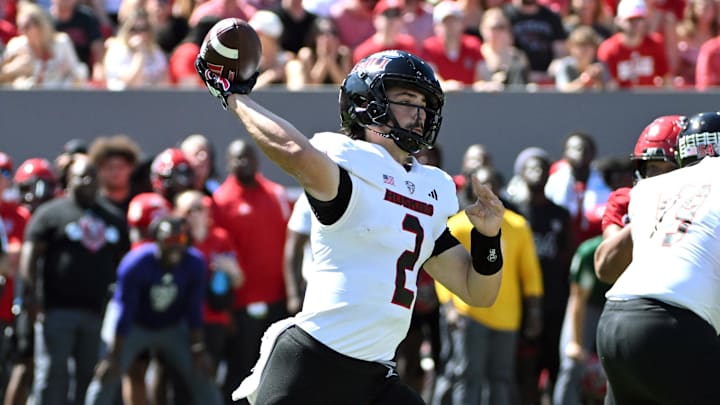 Sep 28, 2024; Raleigh, North Carolina, USA; Northern Illinois Huskies quarter back Ethan Hampton (2) throws a pass against the North Carolina State Wolfpack during second quarter at Carter-Finley Stadium.