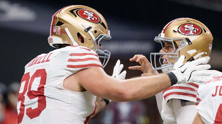 Sep 14, 2025; New Orleans, Louisiana, USA; San Francisco 49ers tight end Luke Farrell (89) celebrates a touchdown with San Francisco 49ers quarterback Mac Jones (10) during the first quarter against the New Orleans Saints at Caesars Superdome. Mandatory Credit: Matthew Hinton-Imagn Images