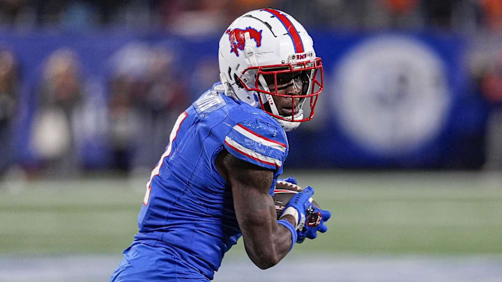 Dec 7, 2024; Charlotte, NC, USA; Southern Methodist Mustangs running back Brashard Smith (1) runs during the fourth quarter against the Clemson Tigers in the 2024 ACC Championship game at Bank of America Stadium. Mandatory Credit: Jim Dedmon-Imagn Images Dec 7, 2024; Charlotte, NC, USA; Southern Methodist Mustangs running back Brashard Smith (1) runs during the fourth quarter against the Clemson Tigers in the 2024 ACC Championship game at Bank of America Stadium. Mandatory Credit: Jim Dedmon-Imagn Images