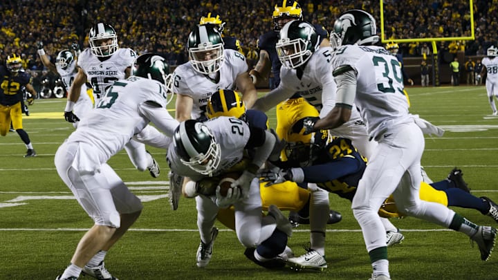 Oct 17, 2015; Ann Arbor, MI, USA; Michigan State Spartans defensive back Jalen Watts-Jackson (20) dives into the end zone for a game winning touchdown as the clock runs out in the fourth quarter against the Michigan Wolverines at Michigan Stadium. Michigan State 27-23. Mandatory Credit: Rick Osentoski-Imagn Images Oct 17, 2015; Ann Arbor, MI, USA; Michigan State Spartans defensive back Jalen Watts-Jackson (20) dives into the end zone for a game winning touchdown as the clock runs out in the fourth quarter against the Michigan Wolverines at Michigan Stadium. Michigan State 27-23. Mandatory Credit: Rick Osentoski-Imagn Images