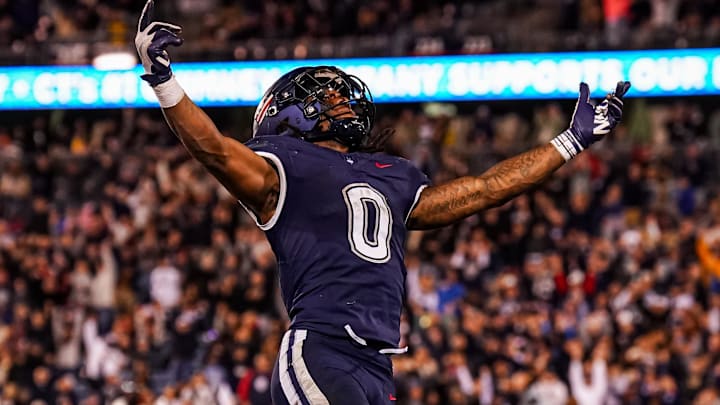 Nov 8, 2025; East Hartford, Connecticut, USA; UConn Huskies running back Cam Edwards (0) scores against the Duke Blue Devils in the second half at Pratt & Whitney Stadium at Rentschler Field. Mandatory Credit: David Butler II-Imagn Images