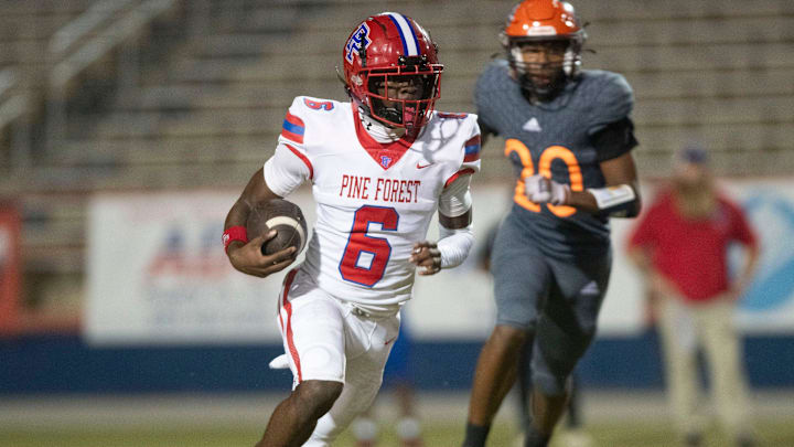 Pine Forest running back Zion Legree (No. 6) slips past the Escambia defense during their district battle.