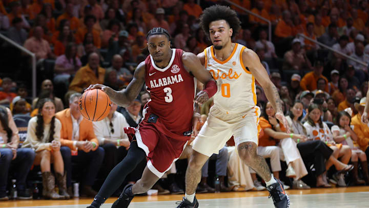 Feb 28, 2026; Knoxville, Tennessee, USA; Alabama Crimson Tide guard Latrell Wrightsell Jr. (3) moves the ball against Tennessee Volunteers guard Ja'kobi Gillespie (0) during the second half at Thompson-Boling Arena at Food City Center. Mandatory Credit: Randy Sartin-Imagn Images Feb 28, 2026; Knoxville, Tennessee, USA; Alabama Crimson Tide guard Latrell Wrightsell Jr. (3) moves the ball against Tennessee Volunteers guard Ja'kobi Gillespie (0) during the second half at Thompson-Boling Arena at Food City Center. Mandatory Credit: Randy Sartin-Imagn Images