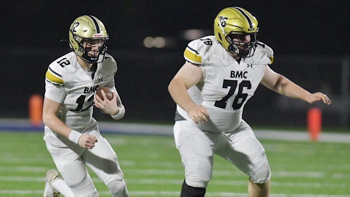 Bishop Moore's Grant Allen (76) blocks for quarterback Bjorn Jurgensen (12) on a first quarter run. Orlando  s Bishop Moore High School traveled to Jacksonville  s Riverside High School for the Class 3M football Playoffs Friday, November 17, 2023. The Riverside Generals trailed 22 to 13 at the half and battled back in the second half but fell short, ending their season with a 37 to 35 loss to the Bishop Moore Hornets.