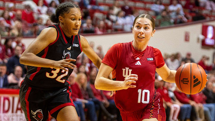 Indiana's Shay Ciezki (10) drives past Rutgers' Kiyomi McMiller (32) at Simon Skjodt Assembly Hall. Indiana's Shay Ciezki (10) drives past Rutgers' Kiyomi McMiller (32) at Simon Skjodt Assembly Hall.