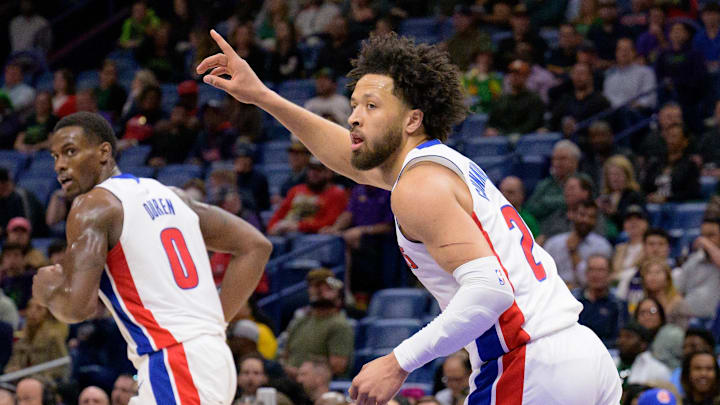Mar 17, 2025; New Orleans, Louisiana, USA;  Detroit Pistons guard Cade Cunningham (2) reacts after a score next to center Jalen Duren (0) during the first half against the New Orleans Pelicans at Smoothie King Center. Mandatory Credit: Matthew Hinton-Imagn Images
