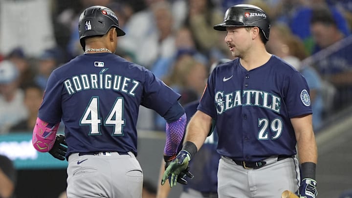 Julio Rodriguez (44) celebrates with catcher Cal Raleigh (29) after hitting a solo home run against the Toronto Blue Jays. Julio Rodriguez (44) celebrates with catcher Cal Raleigh (29) after hitting a solo home run against the Toronto Blue Jays.