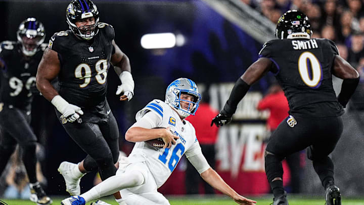 Detroit Lions quarterback Jared Goff (16) slides against Baltimore Ravens linebacker Roquan Smith (0) and defensive end DJ Reader (98) during the first half at M&T Bank Stadium in Baltimore, Md. on Monday, Sept. 22, 2025. Detroit Lions quarterback Jared Goff (16) slides against Baltimore Ravens linebacker Roquan Smith (0) and defensive end DJ Reader (98) during the first half at M&T Bank Stadium in Baltimore, Md. on Monday, Sept. 22, 2025.