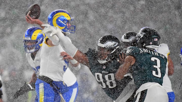 Jan 19, 2025; Philadelphia, Pennsylvania, USA; Los Angeles Rams quarterback Matthew Stafford (9) is pressured by Philadelphia Eagles defensive tackle Jalen Carter (98) during the fourth quarter in a 2025 NFC divisional round game at Lincoln Financial Field. 