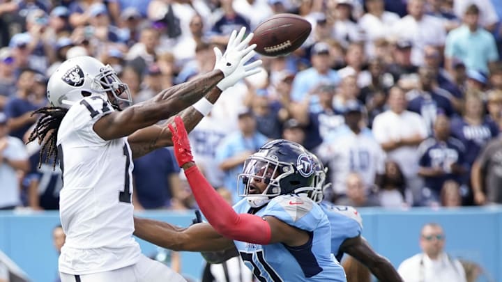 Sep 25, 2022; Nashville, Tennessee, USA; Las Vegas Raiders wide receiver Davante Adams (17) catches a touchdown pass over Tennessee Titans safety Kevin Byard (31) during the second quarter at Nissan Stadium. Mandatory Credit: Andrew Nelles-Imagn Images