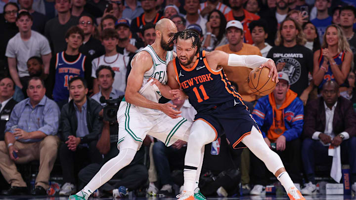 May 12, 2025; New York, New York, USA; New York Knicks guard Jalen Brunson (11) dribbles as Boston Celtics guard Derrick White (9) defends in the second half during game four of the second round for the 2025 NBA Playoffs at Madison Square Garden. Mandatory Credit: Vincent Carchietta-Imagn Images