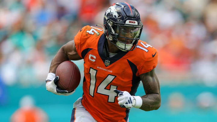 Sep 24, 2023; Miami Gardens, Florida, USA; Denver Broncos wide receiver Courtland Sutton (14) runs with the ball against the Miami Dolphins in the third quarter at Hard Rock Stadium. Mandatory Credit: Nathan Ray Seebeck-USA TODAY Sports Sep 24, 2023; Miami Gardens, Florida, USA; Denver Broncos wide receiver Courtland Sutton (14) runs with the ball against the Miami Dolphins in the third quarter at Hard Rock Stadium. Mandatory Credit: Nathan Ray Seebeck-USA TODAY Sports