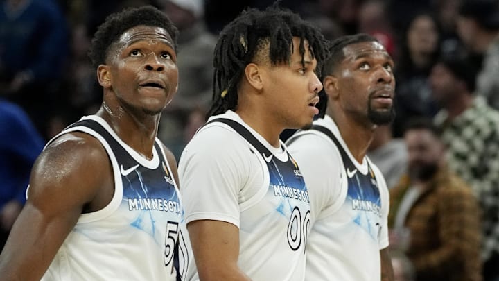 Feb 13, 2025; Minneapolis, Minnesota, USA; Minnesota Timberwolves guard Anthony Edwards (5) and guard Terrence Shannon Jr. (00) and center Naz Reid (11) walk off the court for a timeout in the first quarter of the game with the Oklahoma City Thunder at Target Center. Mandatory Credit: Bruce Kluckhohn-Imagn Images
