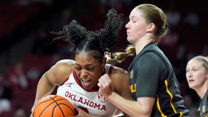 Oklahoma 's Sahara Williams (6) drives to the basket as Missouri's Grace Slaughter (0) defends during the second half of the women's college basketball game between the University of Oklahoma Sooners and the Missouri Tigers at Lloyd Noble Center in Noble, Okla., Thursday, Jan., 16, 2025.