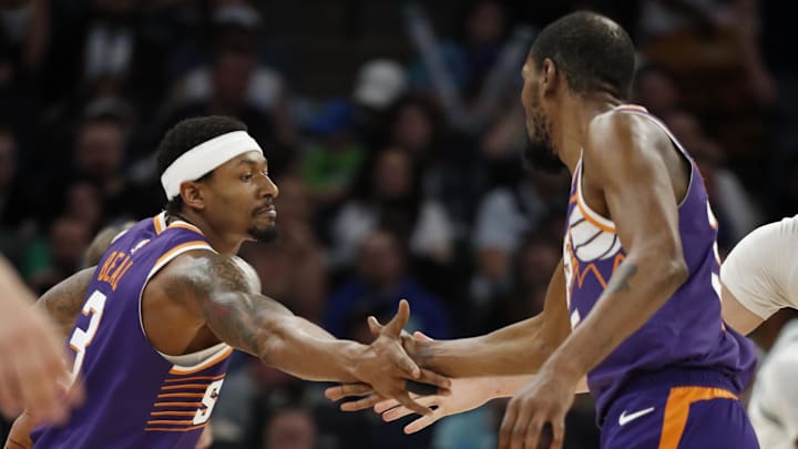 Apr 14, 2024; Minneapolis, Minnesota, USA; Phoenix Suns guard Bradley Beal (3) celebrates his basket against the Minnesota Timberwolves with forward Kevin Durant (35) in the fourth quarter at Target Center. Mandatory Credit: Bruce Kluckhohn-Imagn Images