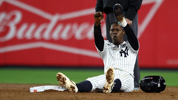 Oct 29, 2024; Bronx, New York, USA; New York Yankees third baseman Jazz Chisholm Jr. (13) reacts after stealing second base against the Los Angeles Dodgers in the third inning during game four of the 2024 MLB World Series at Yankee Stadium. Mandatory Credit: Vincent Carchietta-Imagn Images