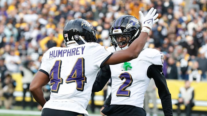 Nov 17, 2024; Pittsburgh, Pennsylvania, USA;  Baltimore Ravens cornerback Marlon Humphrey (44) celebrates with cornerback Nate Wiggins (2) after Humphrey intercepted a pass in the end-zone intended for Pittsburgh Steelers tight end Darnell Washington (not pictured) during the fourth quarter at Acrisure Stadium. Mandatory Credit: Charles LeClaire-Imagn Images
