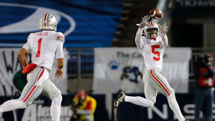 Ohio State Buckeyes quarterback Justin Fields throws a pass to wide receiver Garrett Wilson
