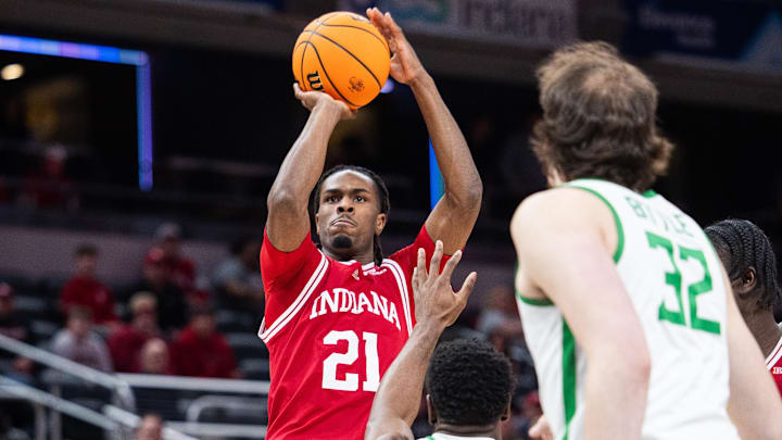 Mar 13, 2025; Indianapolis, IN, USA; Indiana Hoosiers forward Mackenzie Mgbako (21) shoots the ball while Oregon Ducks guard TJ Bamba (5) defends in the first half at Gainbridge Fieldhouse. Mandatory Credit: Trevor Ruszkowski-Imagn Images