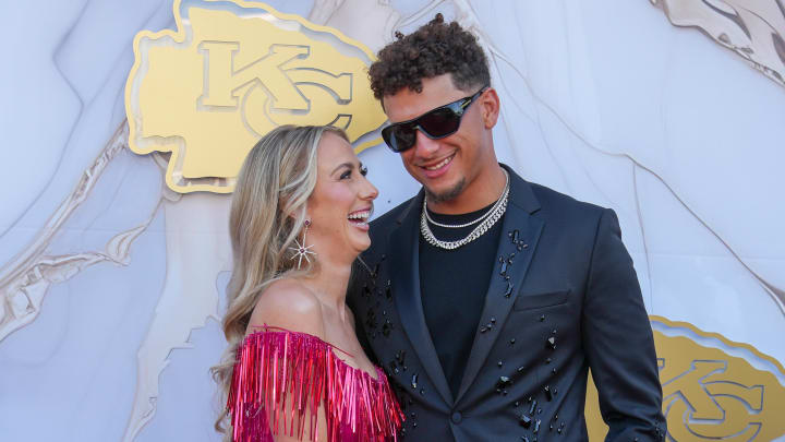 Kansas City Chiefs quarterback Patrick Mahomes and wife Brittany pose for a photo on the red carpet at the Nelson Art Gallery.
