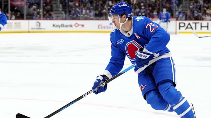 Nov 29, 2025; Denver, Colorado, USA; Colorado Avalanche center Nathan MacKinnon (29) controls the puck in the second period against the Montreal Canadiens at Ball Arena. Mandatory Credit: Ron Chenoy-Imagn Images