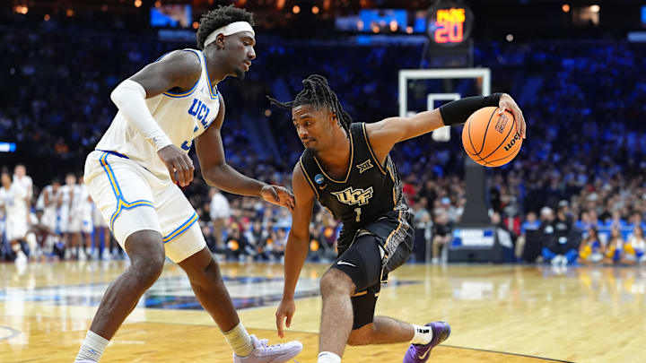 Mar 20, 2026; Philadelphia, PA, USA; UCF Knights guard Themus Fulks (1) dribbles the ball against UCLA Bruins forward Eric Dailey Jr. (3) in the second half during a first round game of the men's 2026 NCAA Tournament at Xfinity Mobile Arena. Mandatory Credit: Kyle Ross-Imagn Images Mar 20, 2026; Philadelphia, PA, USA; UCF Knights guard Themus Fulks (1) dribbles the ball against UCLA Bruins forward Eric Dailey Jr. (3) in the second half during a first round game of the men's 2026 NCAA Tournament at Xfinity Mobile Arena. Mandatory Credit: Kyle Ross-Imagn Images