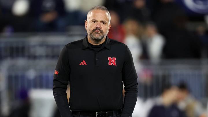 Nov 22, 2025; University Park, Pennsylvania, USA; Nebraska Cornhuskers head coach Matt Rhule stands on the field during a warmup prior to the game against the Penn State Nittany Lions at Beaver Stadium. Mandatory Credit: Matthew O'Haren-Imagn Images