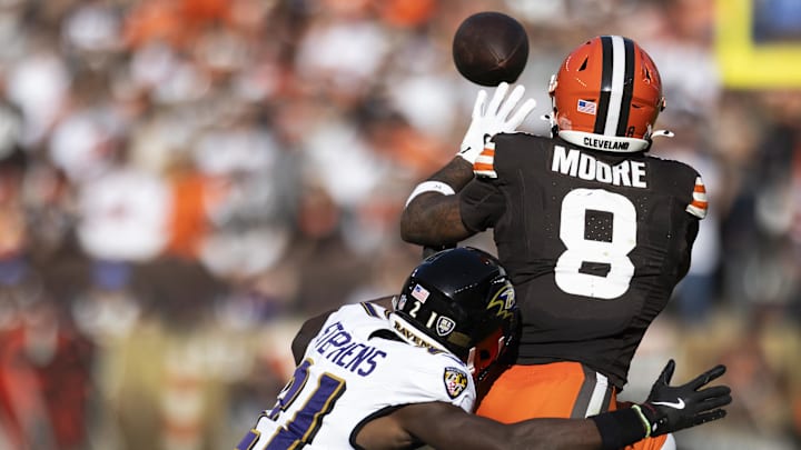 Oct 27, 2024; Cleveland, Ohio, USA; Cleveland Browns wide receiver Elijah Moore (8) makes a catch for a first down under coverage by Baltimore Ravens cornerback Brandon Stephens (21) during the fourth quarter at Huntington Bank Field. Mandatory Credit: Scott Galvin-Imagn Images