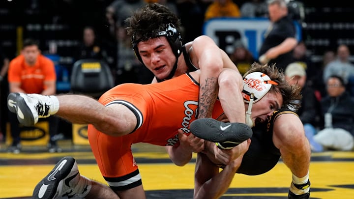 Iowa’s Joey Cruz wrestles Oklahoma State's Troy Spratley in a 125-pound match Sunday, Feb. 23, 2025 at Carver-Hawkeye Arena in Iowa City, Iowa.