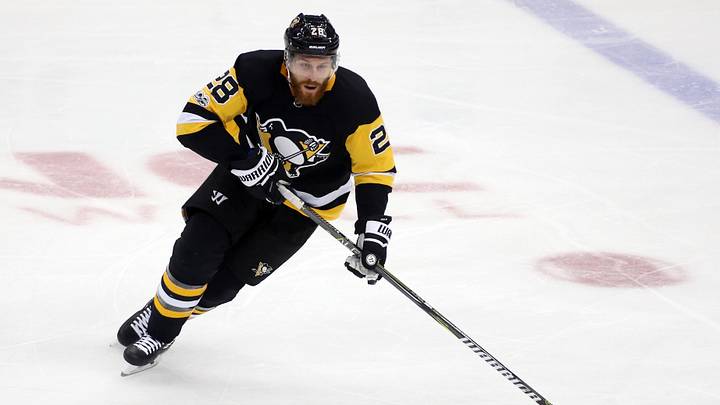 Nov 22, 2017; Pittsburgh, PA, USA;  Pittsburgh Penguins defenseman Ian Cole (28) skates with the puck against the Vancouver Canucks during the second period at PPG PAINTS Arena. Vancouver won 5-2. Mandatory Credit: Charles LeClaire-USA TODAY Sports
