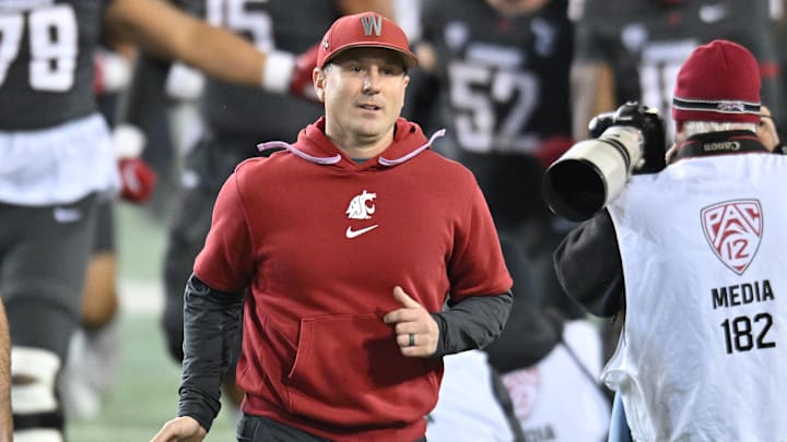 Nov 9, 2024; Pullman, Washington, USA; Washington State Cougars head coach Jake Dickert runs onto the field before a game against the Utah State Aggies at Gesa Field at Martin Stadium. 
