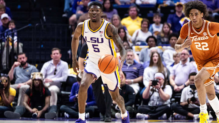 Feb 1, 2025; Baton Rouge, Louisiana, USA; LSU Tigers guard Cam Carter (5) brings the ball up court against Texas Longhorns forward Devon Pryor (22) during the first half at Pete Maravich Assembly Center. Mandatory Credit: Stephen Lew-Imagn Images Feb 1, 2025; Baton Rouge, Louisiana, USA; LSU Tigers guard Cam Carter (5) brings the ball up court against Texas Longhorns forward Devon Pryor (22) during the first half at Pete Maravich Assembly Center. Mandatory Credit: Stephen Lew-Imagn Images