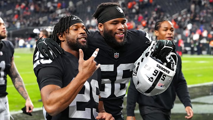 Jan 7, 2024; Paradise, Nevada, USA; Las Vegas Raiders safety Chris Smith II (29) and Las Vegas Raiders linebacker Amari Burney (56) celebrate after the Raiders defeated the Denver Broncos 27-14 at Allegiant Stadium. Mandatory Credit: Stephen R. Sylvanie-Imagn Images