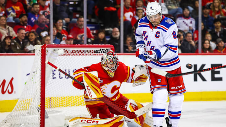 Oct 26, 2025; Calgary, Alberta, CAN; New York Rangers center J.T. Miller (8) screens in front as Calgary Flames goaltender Dustin Wolf (32) makes a save during the third period at Scotiabank Saddledome. Mandatory Credit: Sergei Belski-Imagn Images Oct 26, 2025; Calgary, Alberta, CAN; New York Rangers center J.T. Miller (8) screens in front as Calgary Flames goaltender Dustin Wolf (32) makes a save during the third period at Scotiabank Saddledome. Mandatory Credit: Sergei Belski-Imagn Images