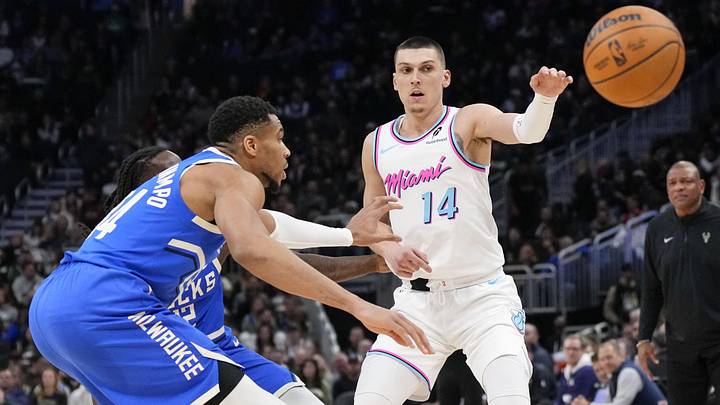 Feb 23, 2025; Milwaukee, Wisconsin, USA; Miami Heat guard Tyler Herro (14) passes the ball away from Milwaukee Bucks forward Giannis Antetokounmpo (34) during the third quarter at Fiserv Forum. Mandatory Credit: Jeff Hanisch-Imagn Images Feb 23, 2025; Milwaukee, Wisconsin, USA; Miami Heat guard Tyler Herro (14) passes the ball away from Milwaukee Bucks forward Giannis Antetokounmpo (34) during the third quarter at Fiserv Forum. Mandatory Credit: Jeff Hanisch-Imagn Images