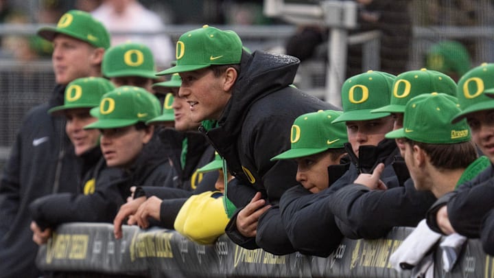 Th Oregon dugout cheers on the Ducks against the Toledo Rockets at PK Park in Eugene.