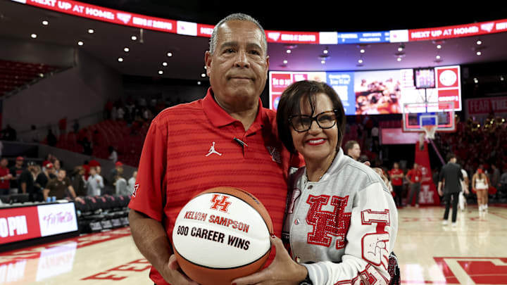 Houston Cougars head coach Kelvin Sampson and his wife Karen Sampson pose with tonight a basketball commemorating his 800th win. The Cougars beat the Lehigh Mountain Hawks at Fertitta Center. 