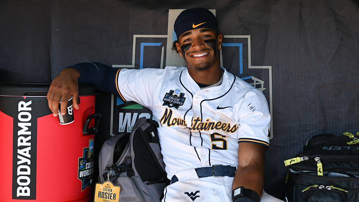 Jun 17, 2026; Omaha, NE, USA; West Virginia Mountaineers right fielder Armani Guzman (5) in the dugout during a break in the seventh inning against the North Carolina Tar Heels at Charles Schwab Field. Mandatory Credit: Steven Branscombe-Imagn Images Jun 17, 2026; Omaha, NE, USA; West Virginia Mountaineers right fielder Armani Guzman (5) in the dugout during a break in the seventh inning against the North Carolina Tar Heels at Charles Schwab Field. Mandatory Credit: Steven Branscombe-Imagn Images