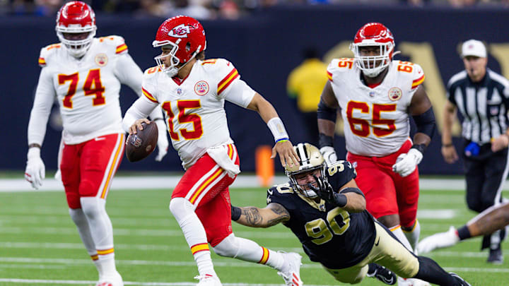 Aug 13, 2023; New Orleans, Louisiana, USA; New Orleans Saints defensive tackle Bryan Bresee (90) misses the tackle on Kansas City Chiefs quarterback Patrick Mahomes (15) during the first half at the Caesars Superdome. Mandatory Credit: Stephen Lew-Imagn Images