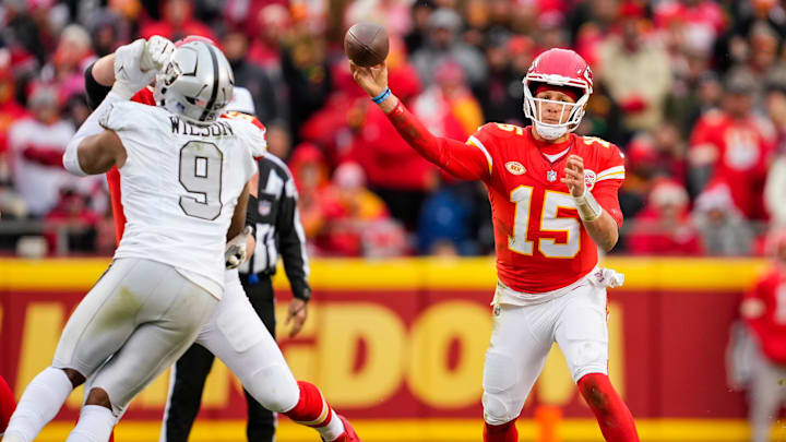 Dec 25, 2023; Kansas City, Missouri, USA; Kansas City Chiefs quarterback Patrick Mahomes (15) throws a pass during the first half against the Las Vegas Raiders at GEHA Field at Arrowhead Stadium. Mandatory Credit: Jay Biggerstaff-Imagn Images