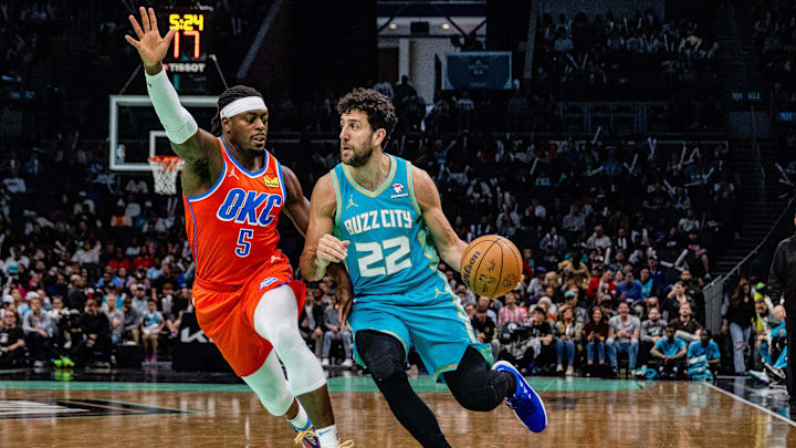 Apr 7, 2024; Charlotte, North Carolina, USA; Oklahoma City Thunder guard Luguentz Dort (5) guards the drive from Charlotte Hornets guard Vasilije Micic (22) during the third quarter at Spectrum Center. Mandatory Credit: Scott Kinser-Imagn Images Apr 7, 2024; Charlotte, North Carolina, USA; Oklahoma City Thunder guard Luguentz Dort (5) guards the drive from Charlotte Hornets guard Vasilije Micic (22) during the third quarter at Spectrum Center. Mandatory Credit: Scott Kinser-Imagn Images