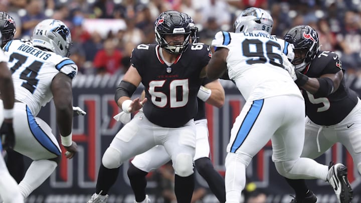 Aug 16, 2025; Houston, Texas, USA; Houston Texans center Jake Andrews (60) attempts to block Carolina Panthers defensive tackle Jaden Crumedy (96) during the game at NRG Stadium. Mandatory Credit: Troy Taormina-Imagn Images