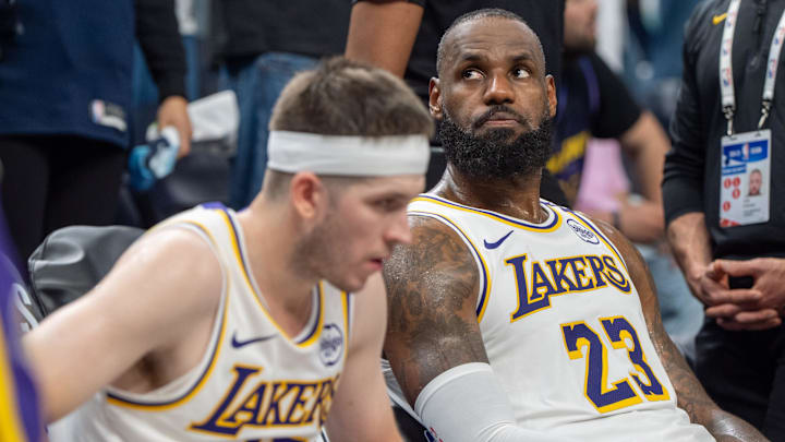 Apr 27, 2025; Minneapolis, Minnesota, USA; Los Angeles Lakers forward LeBron James (23) reacts to a replay that confirms he fouled Minnesota Timberwolves guard Anthony Edwards (5) in the fourth quarter during game four of first round for the 2025 NBA Playoffs at Target Center. Mandatory Credit: Matt Blewett-Imagn Images