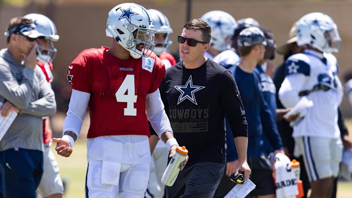 Dallas Cowboys quarterback Dak Prescott talks with offensive coordinator Kellen Moore during training camp.