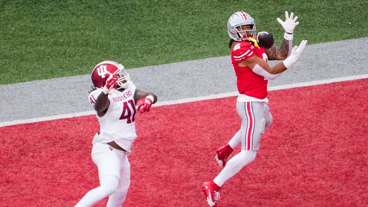 Ohio State Buckeyes wide receiver Emeka Egbuka (2) catches a touchdown pass against Indiana Hoosiers defensive lineman Lanell Carr Jr. (41) in the first half at Ohio Stadium on Saturday, Nov. 23, 2024 in Columbus, Ohio.